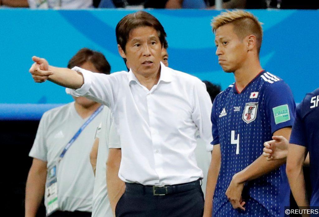 Japan manager Akira Nishino handing out instructions to Keisuke Honda 